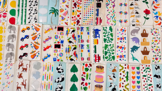 Collection of colorful children's stickers with various designs on a white background