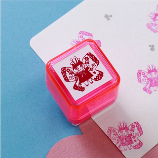 Pink stamp with a design of a butterfly on a blue background