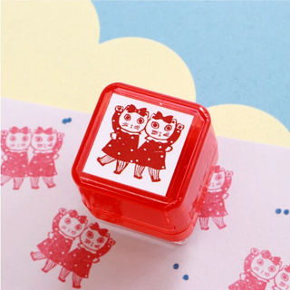 Rubber stamp with cat design on a colorful background
