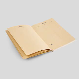 An open journal with off-white, lined pages. One page is titled 'Important Dates' and the other 'My Goals'.